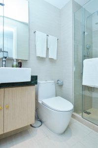 toilet in a very clean bathroom